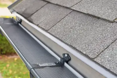 A guard installed on a home's gutter